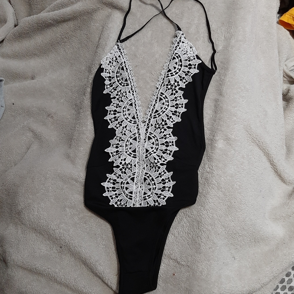 backless plunge neckline cross strapped bodysuit.